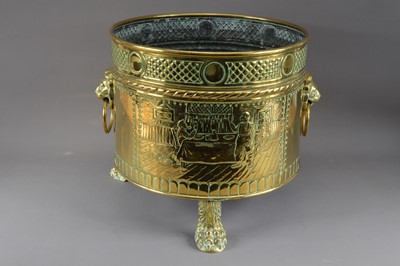 Lot 384 - A large brass footed planter