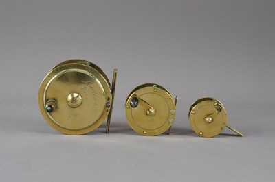 Lot 388 - A collection of three brass antique fishing reels