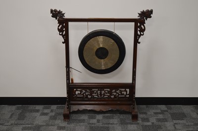 Lot 153 - A mid to late 20th century Chinese hardwood framed gong