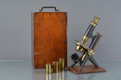 Lot 141 - A 19th Century lacquered and anodised brass Baker Student's Microscope