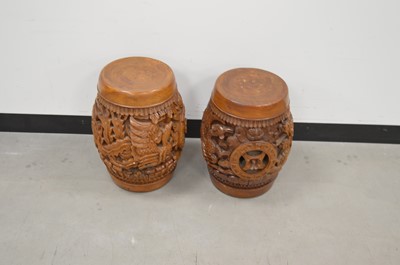 Lot 15 - A pair of Indonesian carved hardwood drum stools
