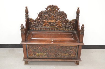 Lot 23 - An Indonesian carved wooden wedding bench