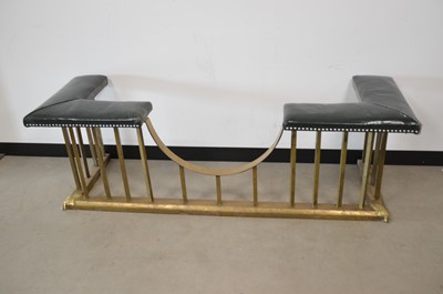 Lot 36 - A vintage brass and upholstered club fender