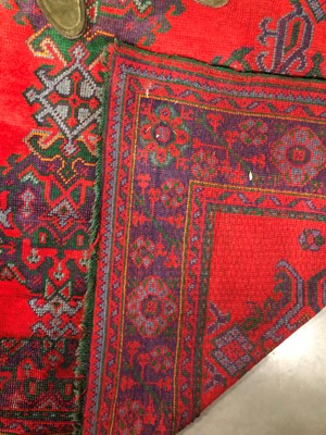 Lot 45 - A large and damaged colourful oushak woollen rug
