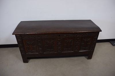 Lot 65 - An 18th century and later carved oak coffer