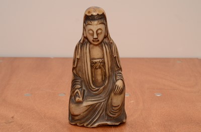 Lot 204 - A carved alabaster Buddha