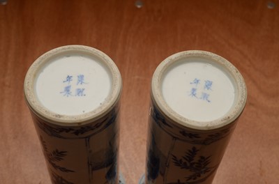 Lot 219 - A pair of late 19th/early 20th century Chinese blue and white porcelain sleeve vases