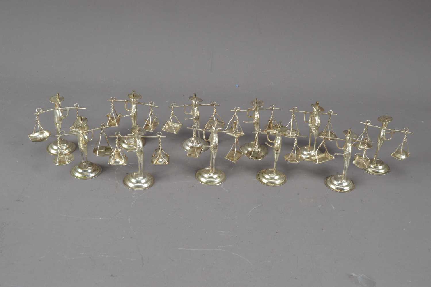 Lot 229 - A collection of Chinese white metal figures