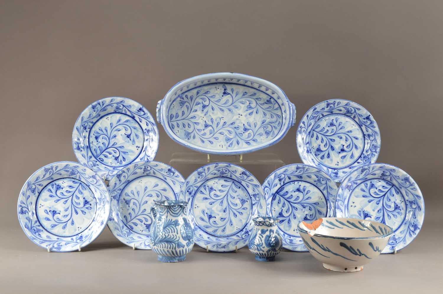 Lot 253 - A collection of tin glazed earthenware dinner items