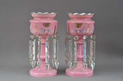 Lot 280 - A pair of late 19th or early 20th century pink glass lustres