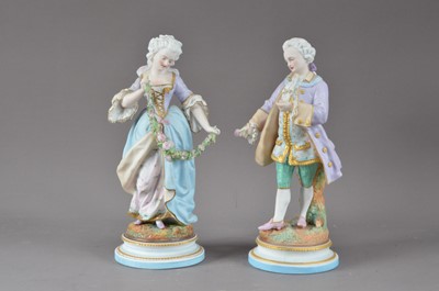 Lot 284 - A pair of early 20th century bisque porcelain figurines