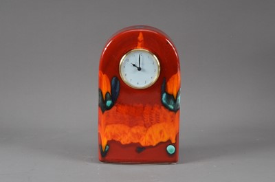 Lot 297 - A Poole pottery mantle clock