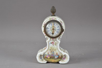 Lot 402 - A small continental porcelain mantle clock
