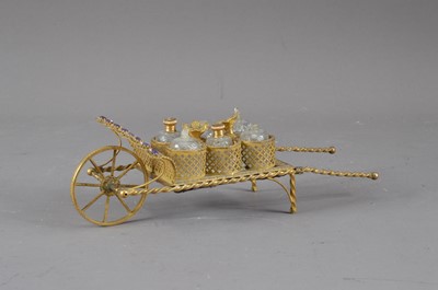 Lot 416 - An early to mid 20th century Continental gilt metal perfume stand in the form of a cart