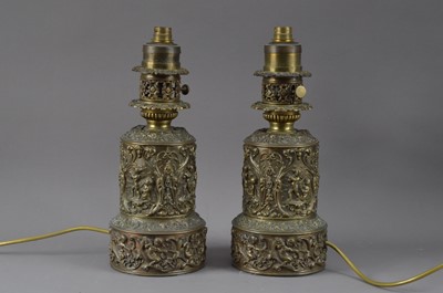 Lot 435 - A pair of decorative bronzed thin metal lamps