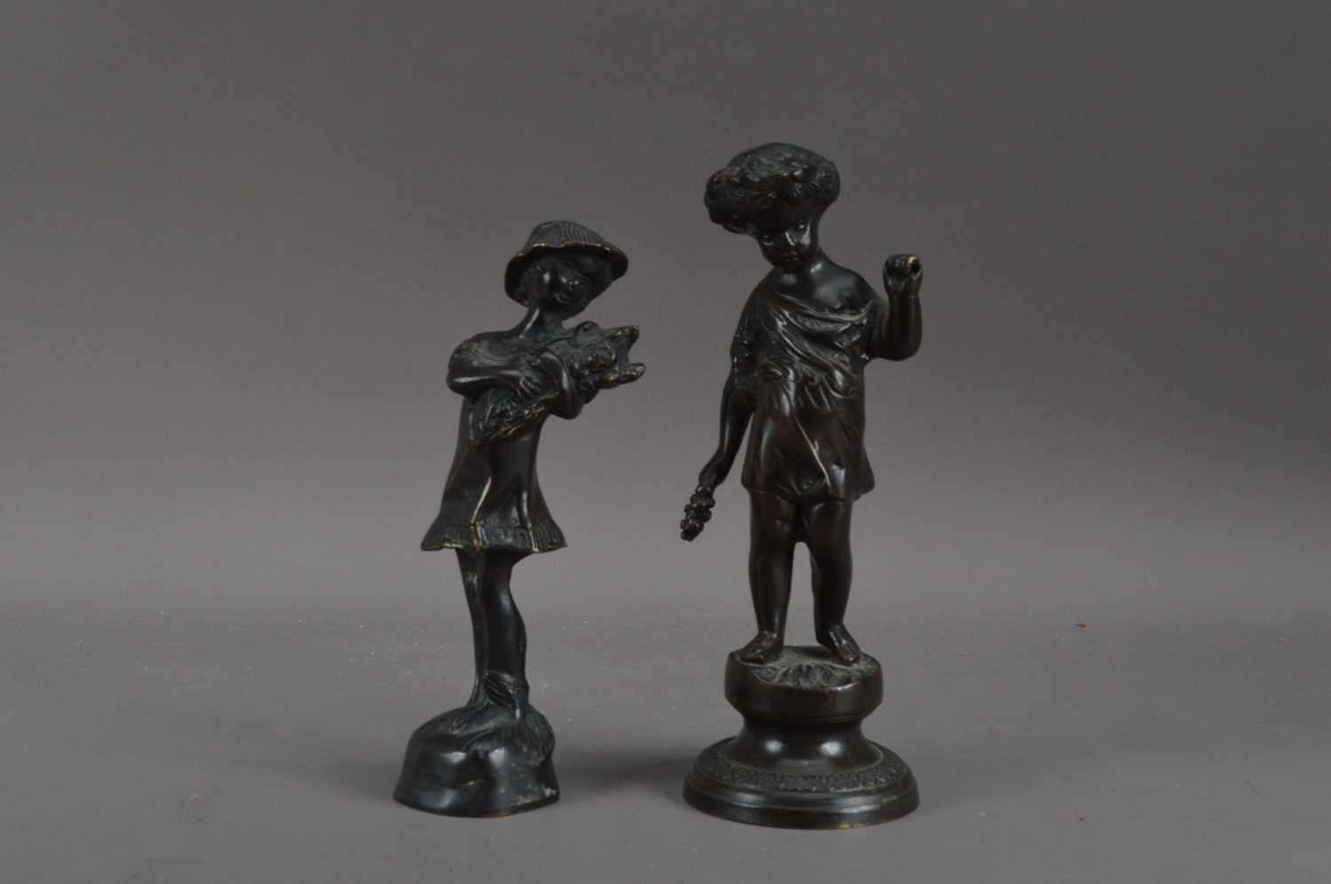 Lot 448 Two cast Bronze statues,