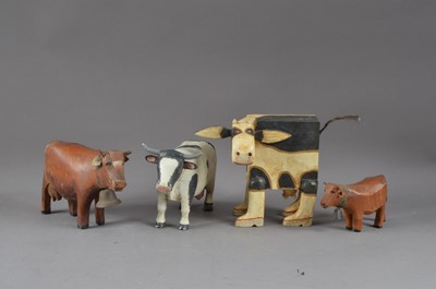 Lot 492 - Four wooden painted cows