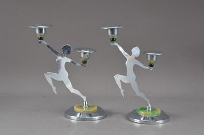 Lot 493 - A pair of stainless steel, art deco style candlesticks