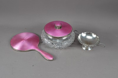 Lot 497 - An art deco silver and enamelled hand mirror and cut glass pot with lid