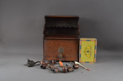 Lot 528 - An Edwardian oak smokers cabinet