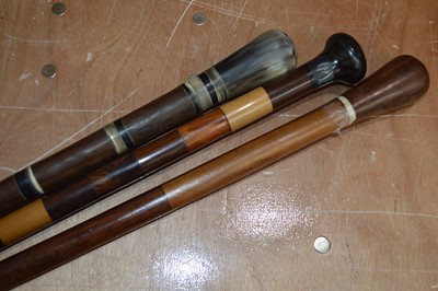 Lot 67 - A group of five leather walking canes