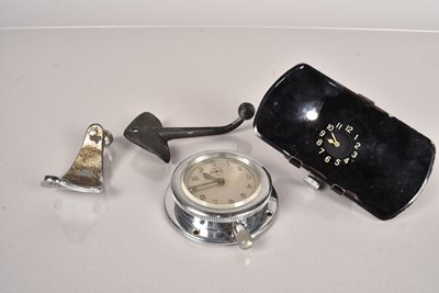 Lot 156 - A vintage rear view mirror with inset clock