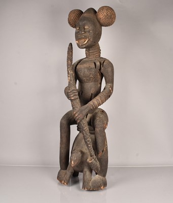 Lot 273 - A large carved African Smoking Male figure