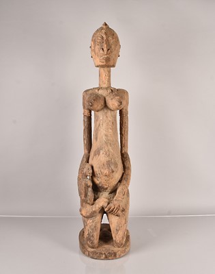 Lot 288 - A large carved female maternity figure