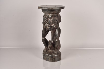 Lot 290 - An African carved wooden figural stand