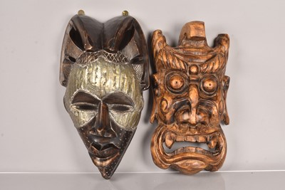 Lot 295 - Two carved wooden masks