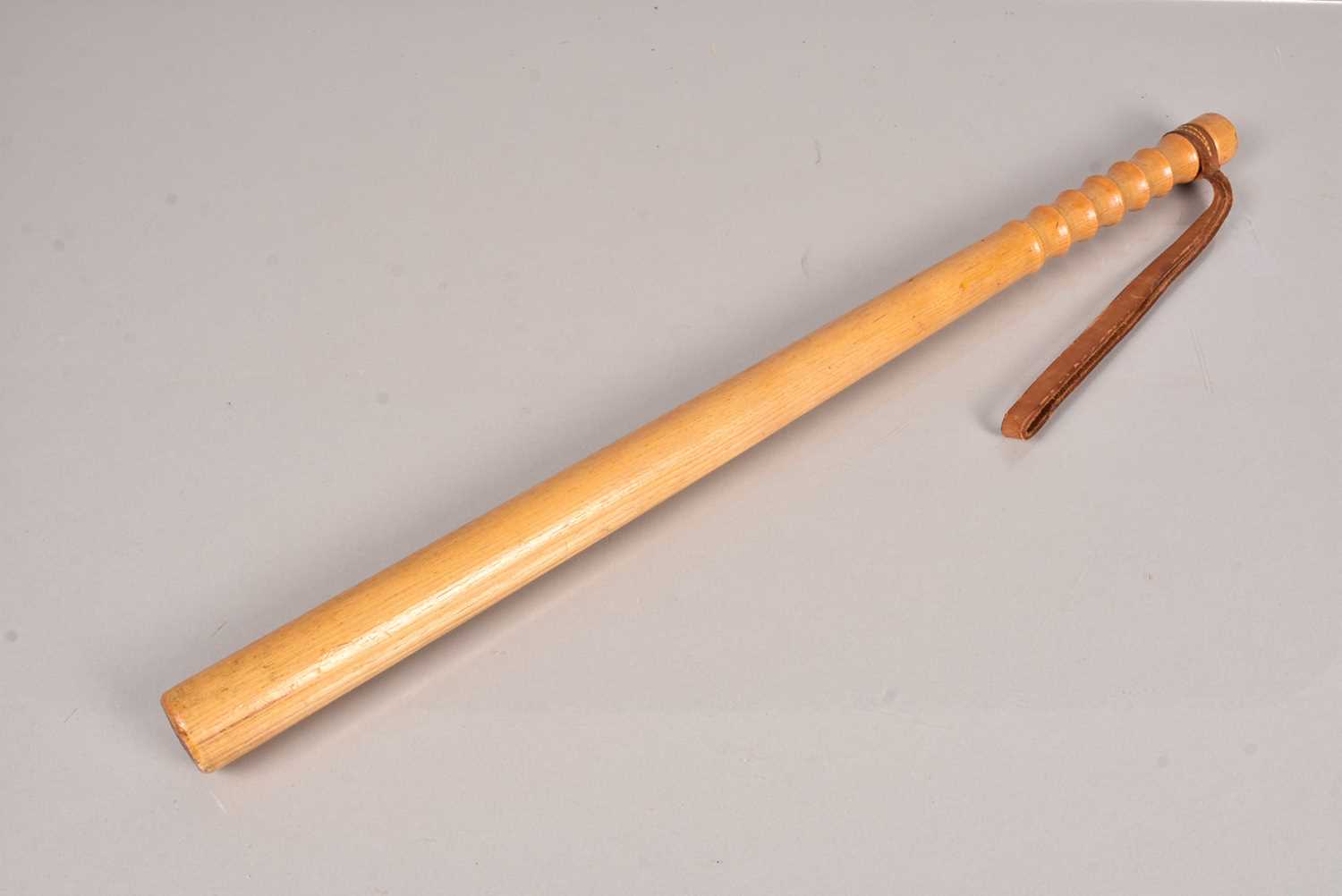 Lot 447 - A Vintage 1970s wooden Police Truncheon