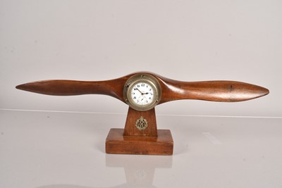 Lot 506 - A Mantle Clock modelled as a wooden Propeller Clock