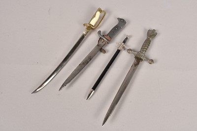 Lot 562 - A group of four letter openers