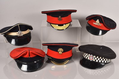 Lot 588 - A collection of Military peak caps