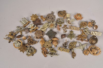 Lot 637 - A collection of WWI and later Regimental cap badges