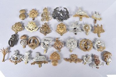 Lot 693 - A collection of British cap badges
