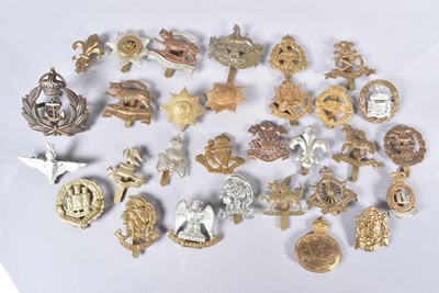 Lot 695 - A collection of British cap badges