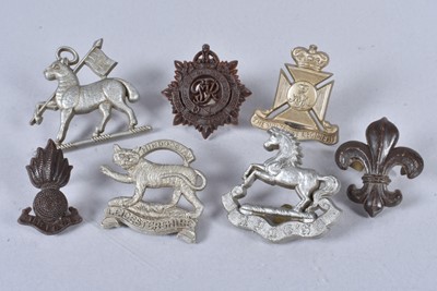 Lot 708 - A group of WWII Plastic Economy cap badges