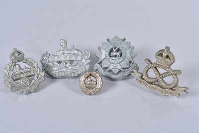 Lot 711 - A group of WWII Plastic Economy cap badges