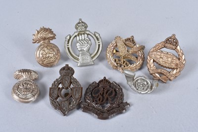 Lot 712 - A group of WWII Plastic Economy cap badges
