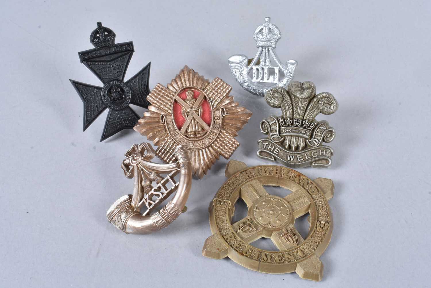 Lot 713 - A collection of WWII Plastic Economy cap badges