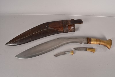 Lot 806 - A brass handled Middle Eastern Kukri knife