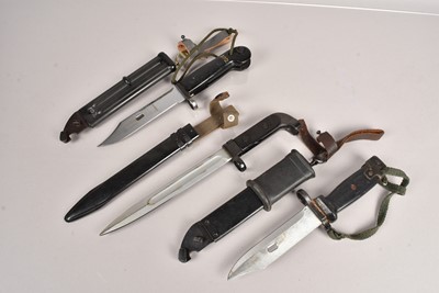 Lot 827 - Three AK47 bayonets and scabbards