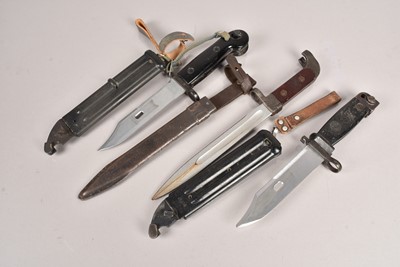 Lot 841 - Three AK47 bayonets and scabbards