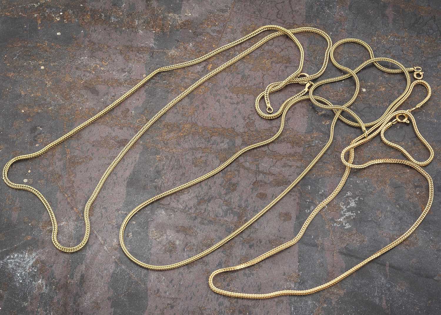 Lot 1 - Three yellow metal Middle Eastern snake link chains