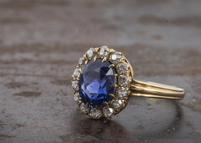 Lot 9 - A Certificated natural corundum No Indications of heating Celyon Sapphire the early 20th Century sapphire and diamond yellow gold cluster ring