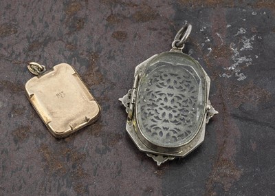 Lot 18 - A 19th Century Continental white and base metal pierced reliquary pendant