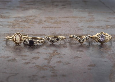 Lot 21 - Four 9ct gold gem set dress rings