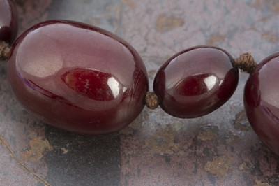Lot 56 - A graduated oval string of 'cherry amber'