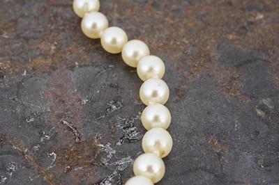 Lot 60 - A string of graduated and knotted cultured pearls